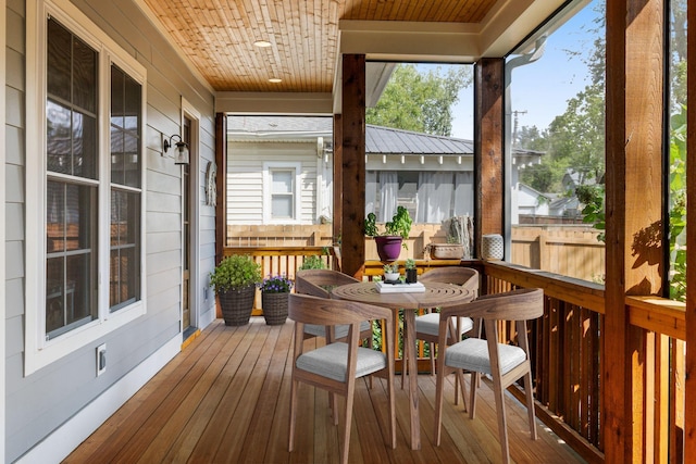 sunroom / solarium with a wealth of natural light and wooden ceiling