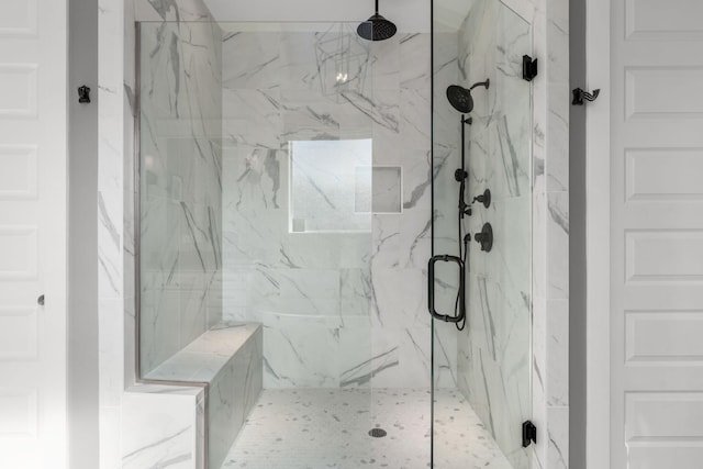 bathroom featuring an enclosed shower