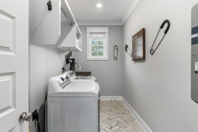 laundry area with crown molding and separate washer and dryer