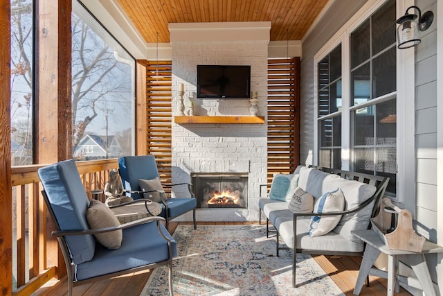 view of patio / terrace featuring a brick fireplace