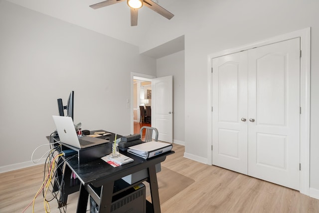 home office featuring light hardwood / wood-style flooring and ceiling fan