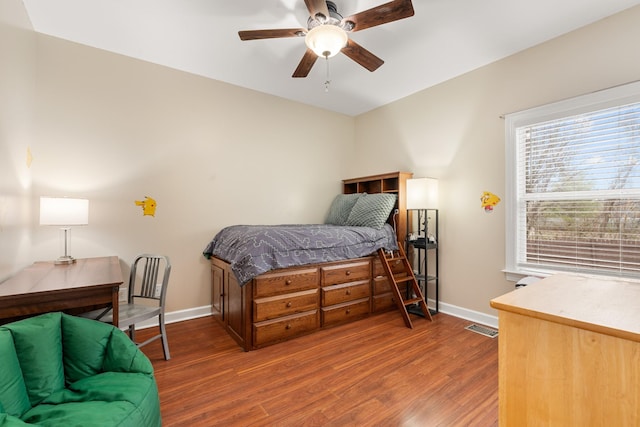 bedroom featuring ceiling fan and dark hardwood / wood-style flooring