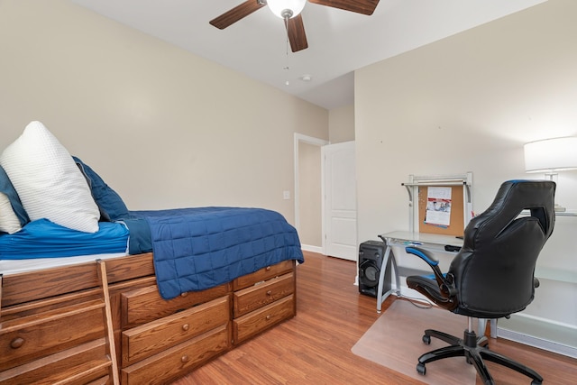 bedroom featuring ceiling fan and wood-type flooring