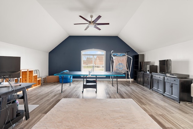 rec room with ceiling fan, light hardwood / wood-style flooring, and lofted ceiling