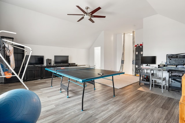 playroom with ceiling fan, light hardwood / wood-style floors, and lofted ceiling