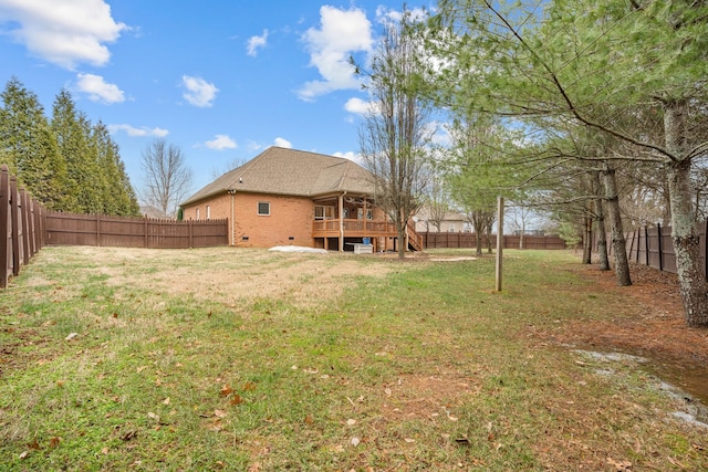 view of yard with a wooden deck