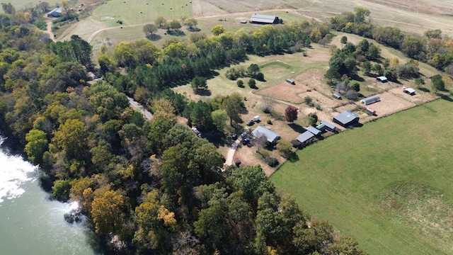 birds eye view of property with a rural view and a water view