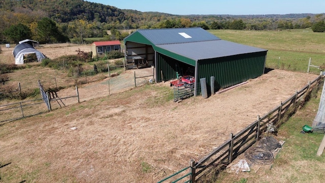 view of stable featuring a rural view