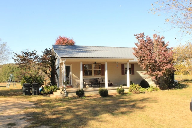 bungalow-style house with a front lawn and a porch