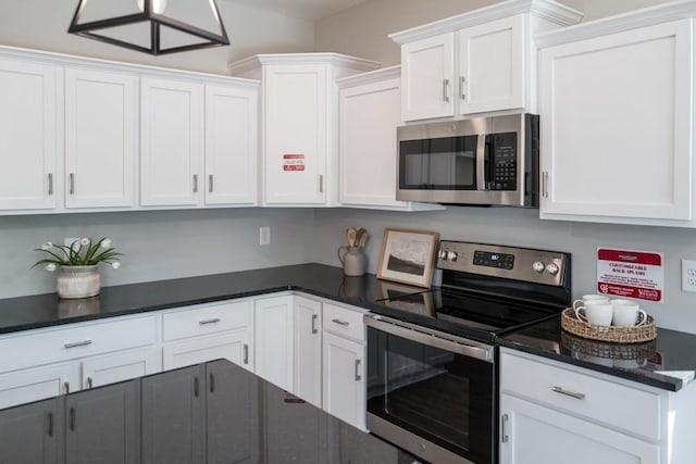 kitchen featuring white cabinets and appliances with stainless steel finishes