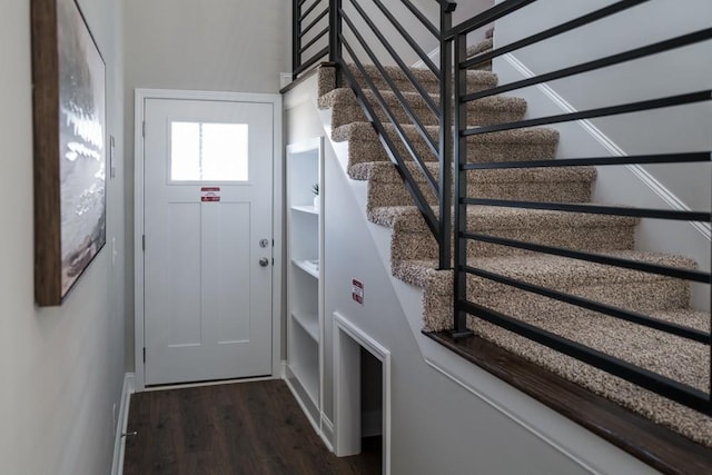 doorway featuring dark wood-type flooring