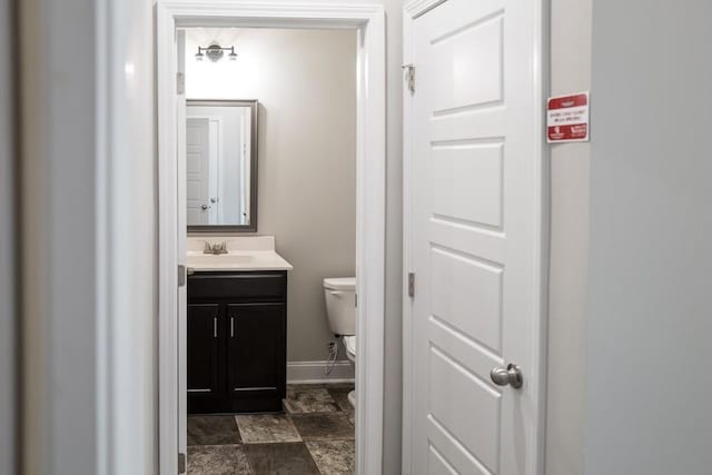 bathroom with vanity and toilet