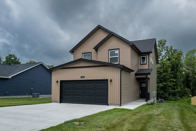 view of front facade featuring a garage and a front lawn