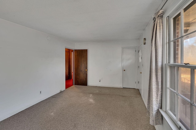 empty room with a textured ceiling