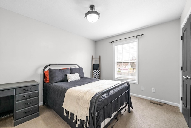 bedroom with light colored carpet