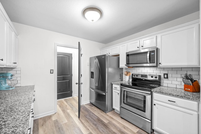 kitchen featuring white cabinets and stainless steel appliances