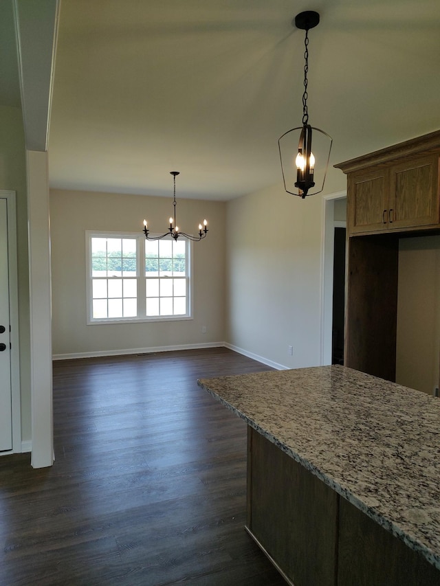 5058 Blue Springs Rd, Smithville, TN 37166 - unfurnished dining area with a chandelier, baseboards, and dark wood-style floors