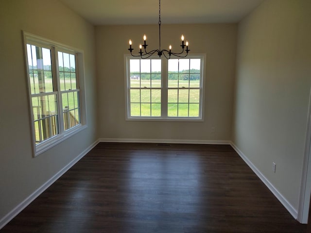 5058 Blue Springs Rd, Smithville, TN 37166 - unfurnished dining area with a chandelier, plenty of natural light, dark wood-style floors, and baseboards