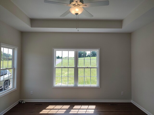 5058 Blue Springs Rd, Smithville, TN 37166 - unfurnished room with plenty of natural light, dark wood-style flooring, a ceiling fan, and baseboards