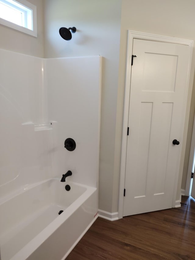 5058 Blue Springs Rd, Smithville, TN 37166 - full bathroom featuring shower / tub combination, wood finished floors, and baseboards