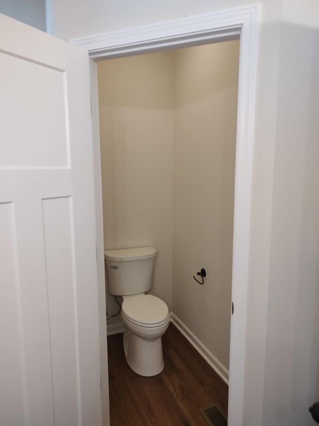 5058 Blue Springs Rd, Smithville, TN 37166 - bathroom featuring wood finished floors, toilet, and baseboards