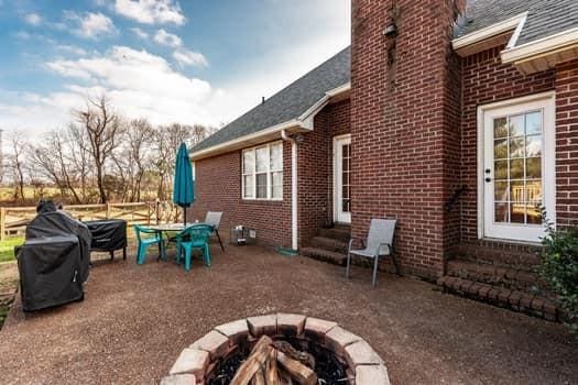 view of patio / terrace featuring an outdoor fire pit