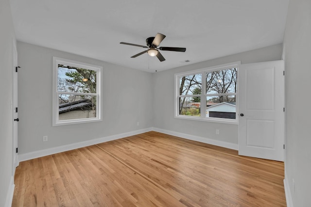 unfurnished bedroom featuring light wood finished floors and baseboards