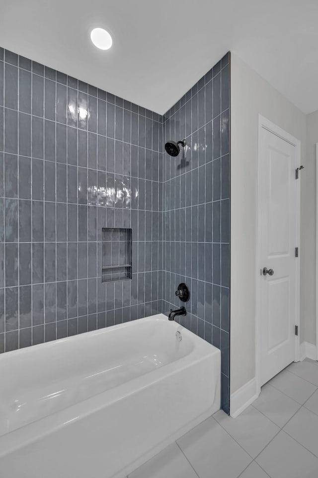 full bathroom featuring shower / bathing tub combination, baseboards, and tile patterned flooring