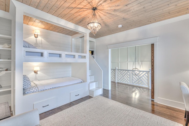 bedroom with wooden ceiling, dark hardwood / wood-style floors, and a notable chandelier