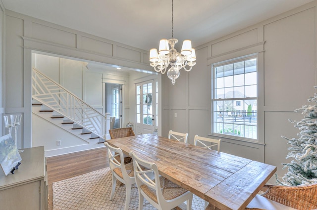 dining area with a chandelier and hardwood / wood-style flooring