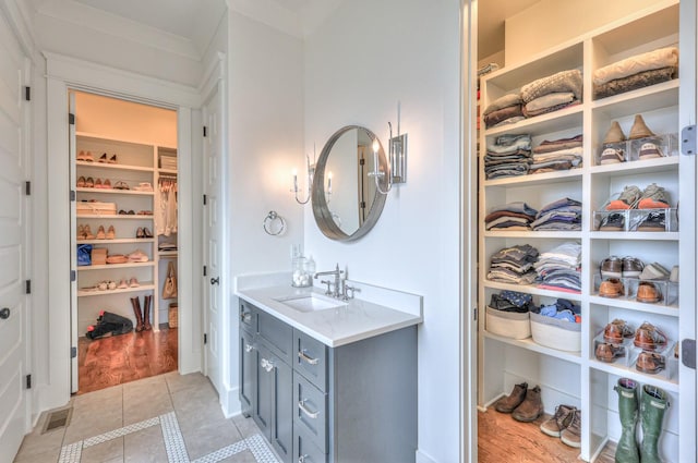 bathroom with tile patterned flooring and vanity