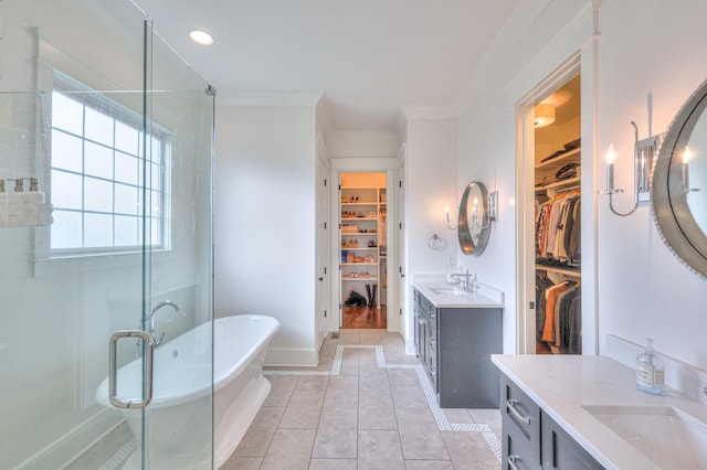 bathroom featuring tile patterned flooring, vanity, independent shower and bath, and crown molding