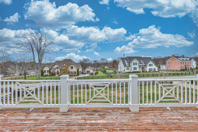 wooden terrace with a yard