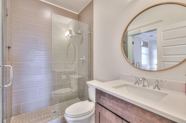 bathroom with vanity, toilet, and walk in shower