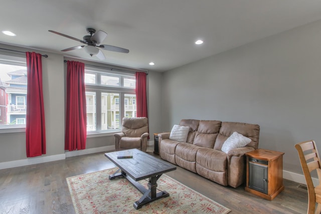 living room featuring hardwood / wood-style floors, ceiling fan, and a healthy amount of sunlight