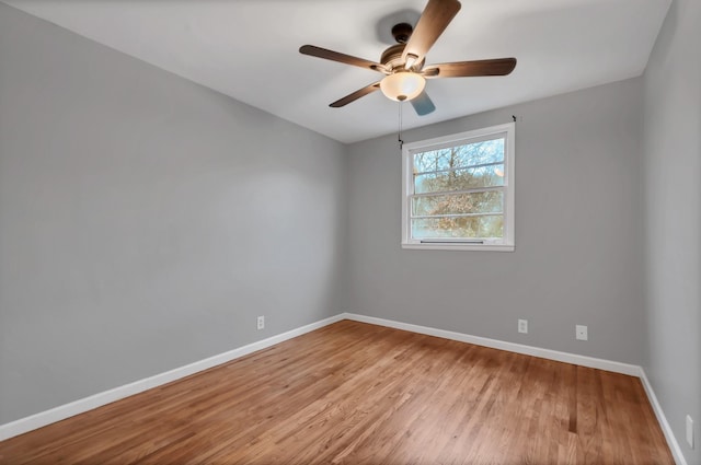 unfurnished room featuring ceiling fan and light wood-type flooring