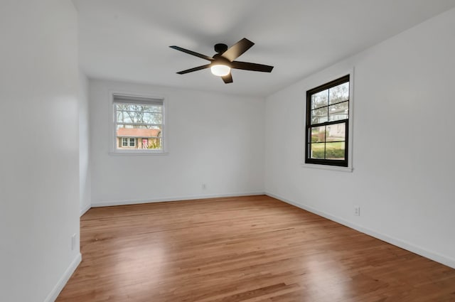 unfurnished room with ceiling fan and light hardwood / wood-style floors