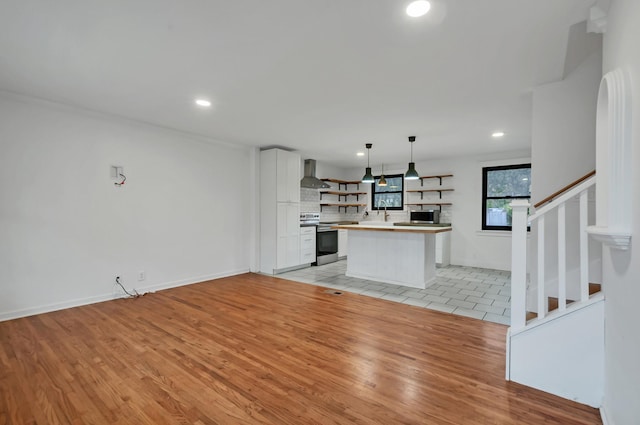 unfurnished living room with light hardwood / wood-style floors