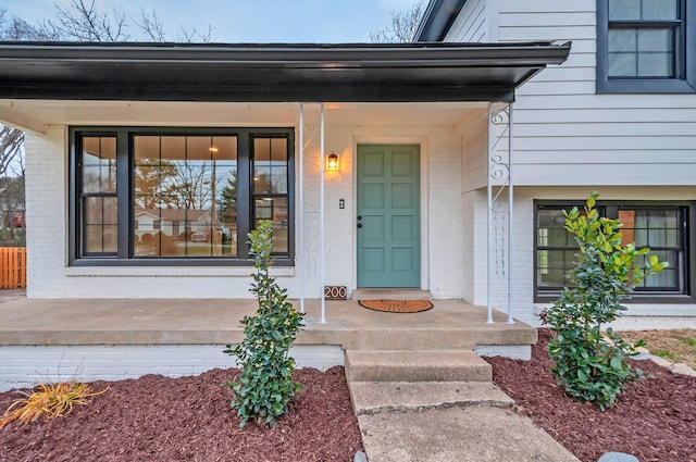 doorway to property with covered porch