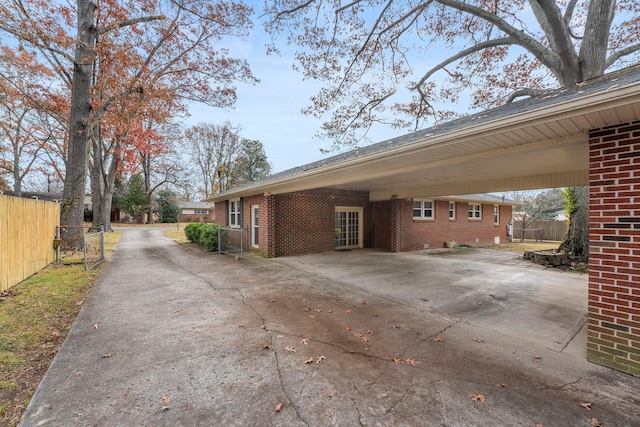 view of side of home featuring a carport