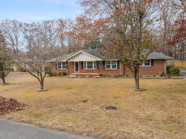 single story home with a porch and a front lawn