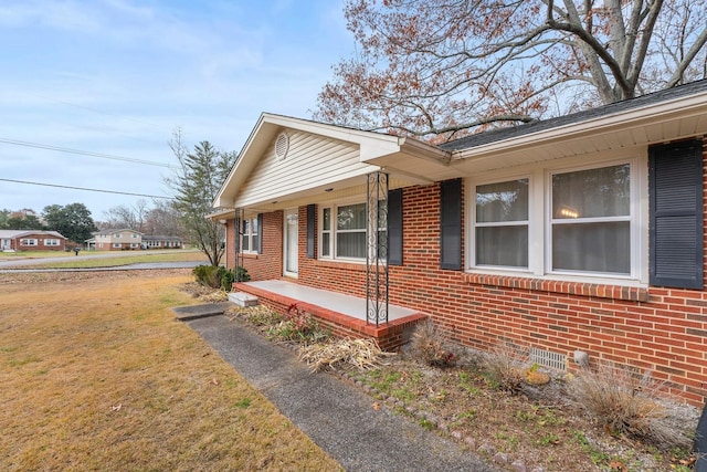 view of side of property featuring a porch