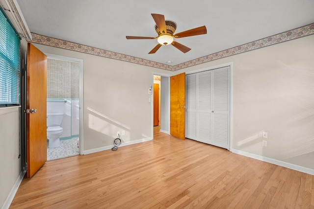 unfurnished bedroom with ensuite bath, ceiling fan, a closet, and light wood-type flooring