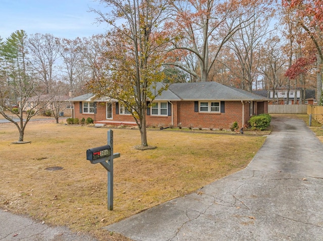 single story home featuring a front yard