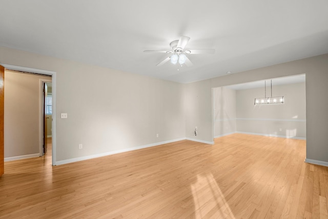 empty room featuring light hardwood / wood-style floors and ceiling fan