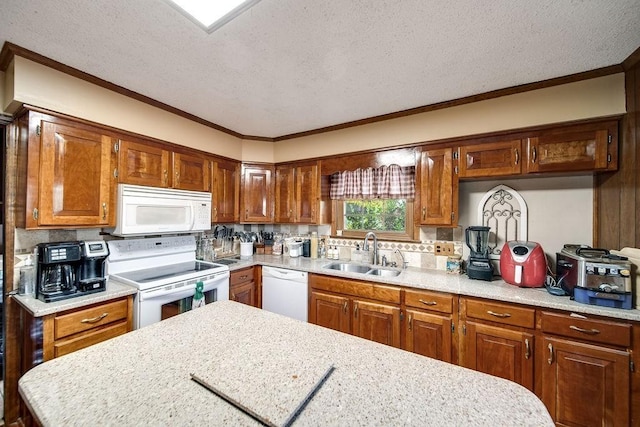 kitchen with a textured ceiling, white appliances, sink, and ornamental molding