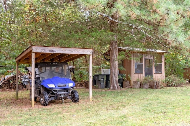 view of yard featuring an outbuilding and a carport