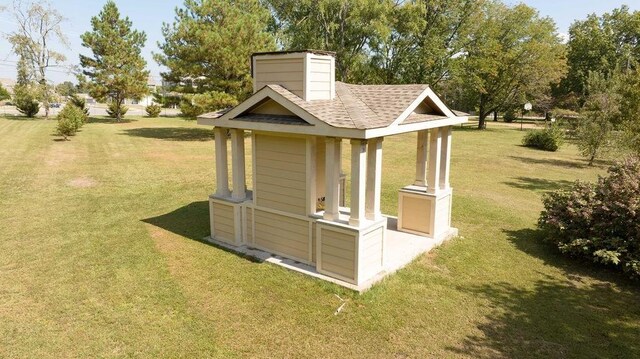 view of outbuilding featuring a lawn