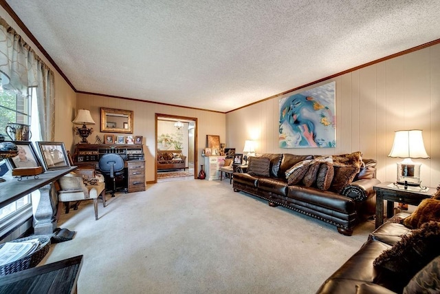 living room with carpet flooring, wooden walls, a textured ceiling, and ornamental molding