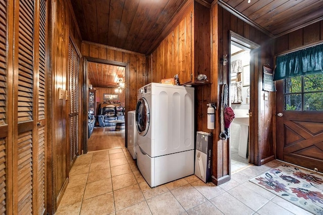 washroom featuring light tile patterned floors, wood ceiling, crown molding, and wood walls